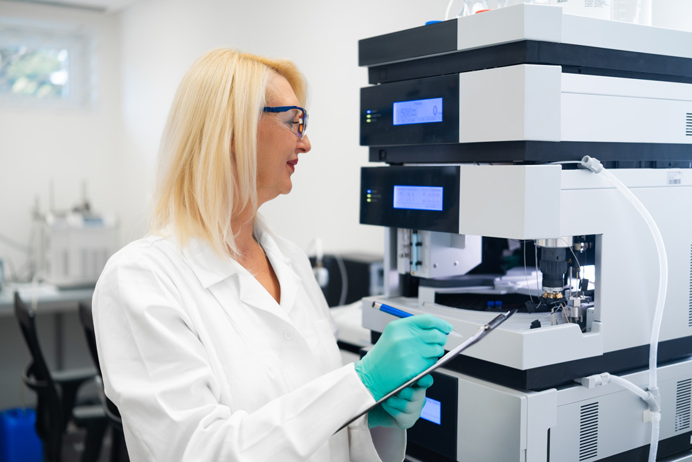 research-scientist-recording-lc-ms-chromatography-findings-laboratory-environment